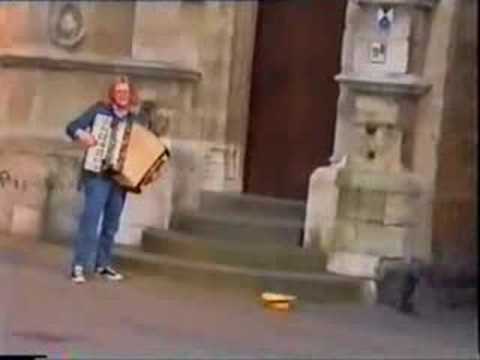 "By that little cafe by the harbour" as a street musician