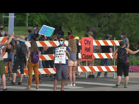 Protesters march down Greenwood Village street after council passes resolution in response to police