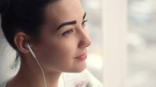 Beauty Charming Young Woman in Earphones Sitting HD Video Scene Background Loop