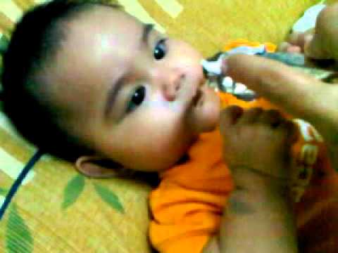 Nur Arissa ; eating dark chocolate.