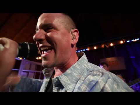 Rapping with my live band in a barn.