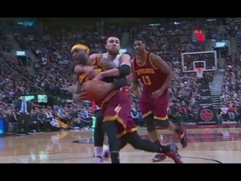 LeBron James tackled by Jonas Valanciunas: Cavaliers at Raptors