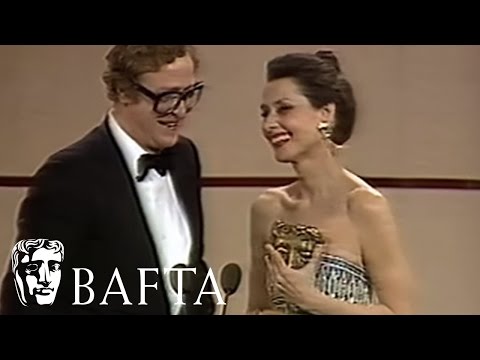 Audrey Hepburn presents Michael Caine with his BAFTA in 1984