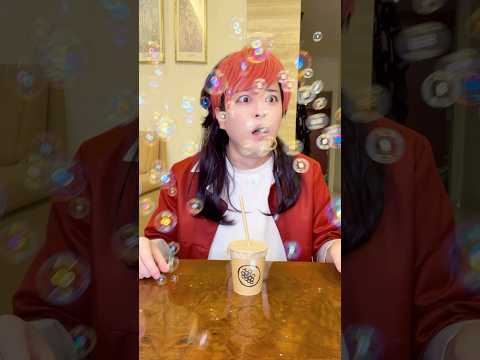 A balloon pops out of a cardboard straw