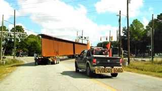 preview picture of video 'Rhett Butler Trucking Bridge Beam Turn With Remote Rear Steer Dolly'