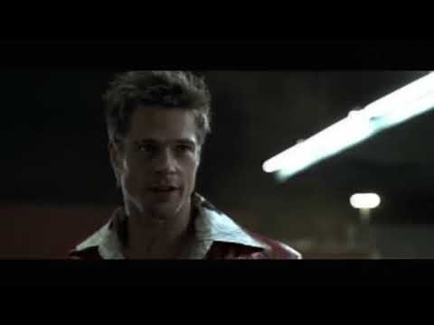 Fight Club trailer frame of the Narrator and Marla, mood-lit interior hinting at character dynamics