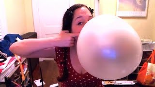 Blowing giant bubble gum bubbles with a whole roll of bubble tape!