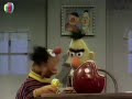 Ernie Leaves His Rubber Duckie On Bert S Desk Arabic