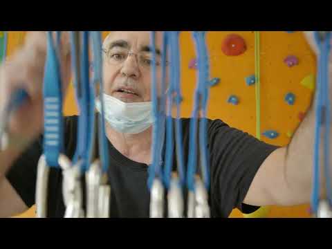 Man attempts to climb a climbing wall after losing mobility - 5/5