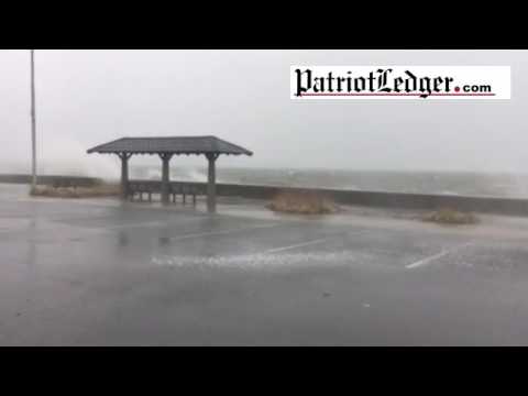 Waves crash over Quincy Shore Dr. as storm begins Thursday morning