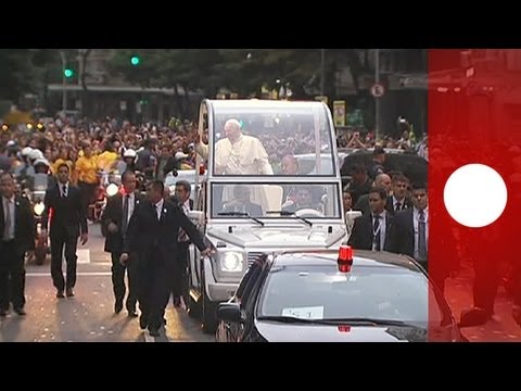 Pope Francis is welcomed by ecstatic crowds in Brazil