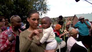 Alicia Keys in Africa to help fight HIV/AIDS with her Keep a Child Alive non-profit charity (2006)
