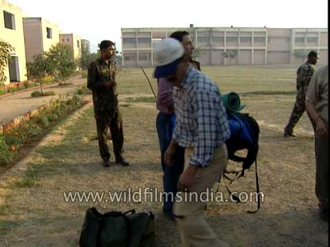 Climbers load luggage in Indian Army Stallion trucks on Everest Expedition