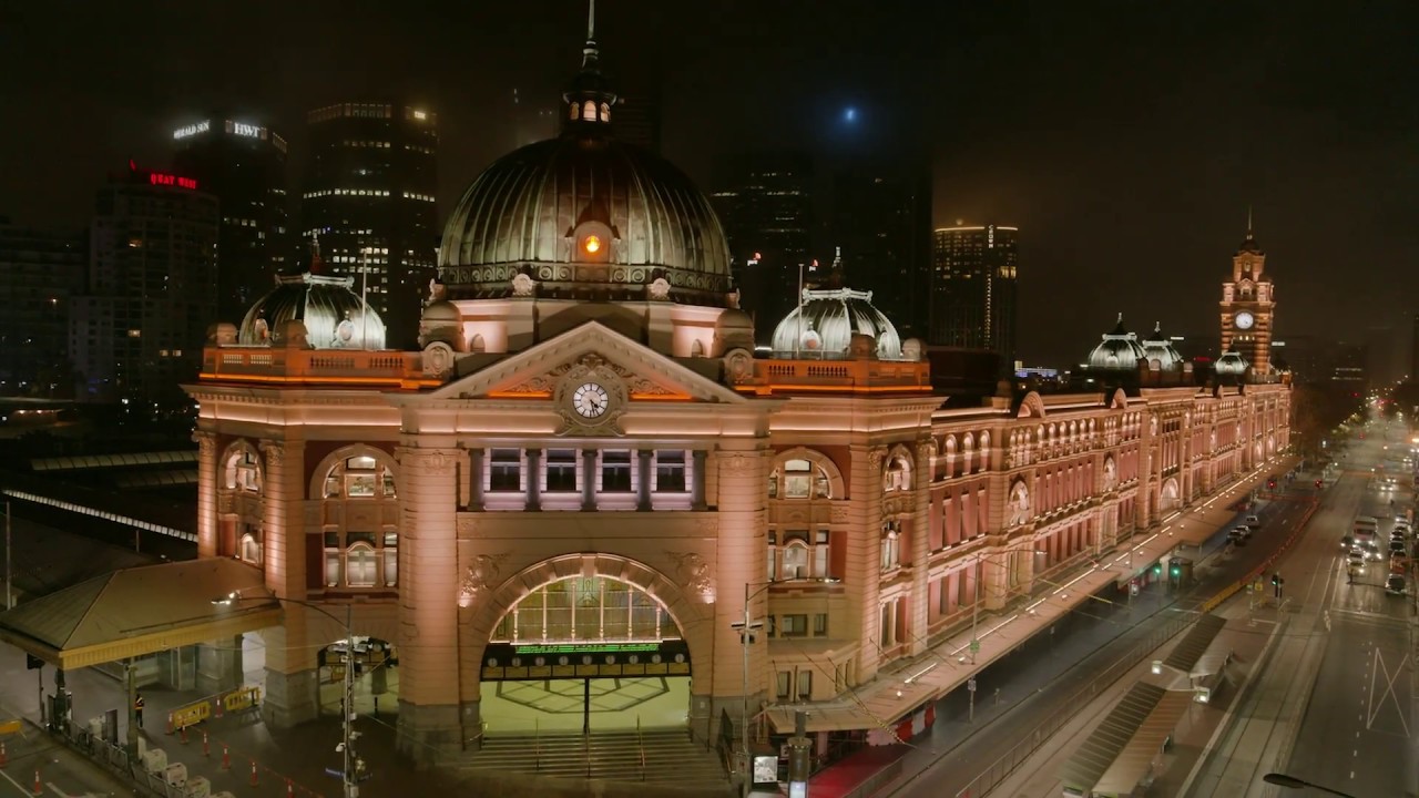 Experience the visuals of light show at Flinders Street Station.