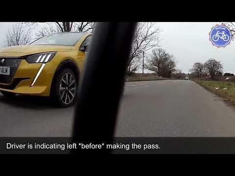 Police warn driver after an aborted left-hook on cyclist