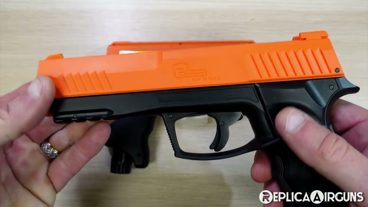 Umarex P2P HDP 50 Compact CO2 Rubber and Powder Ball Less Lethal Pistol Table Top Review