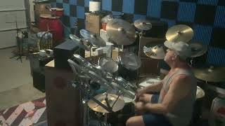 Playing drums with Paul McCartney & Wings (most of side 1 of Venus & Mars) …