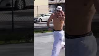 Eminem wearing soap shoes sliding down a rail