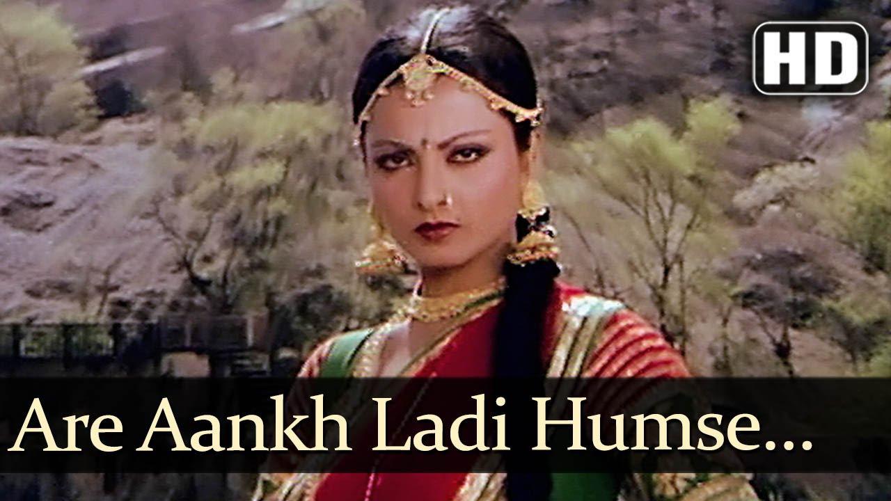 Aankh Ladi Humse Jo Aankh Ladi Toh Dhano Rani Teri Nani Mar Jayegi Lyrics | Ganga Ki Saugand | Kishore Kumar, Asha Bhosle | Kalyanji Anandji