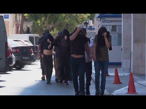 Men taken to court in Athens after football-related attack
