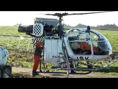 Lama SA315B Helicopter Loading Chemical.