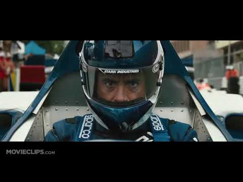 Trailer frame: Monaco track fencing explodes as Whiplash steps out—score surges while guitars bite