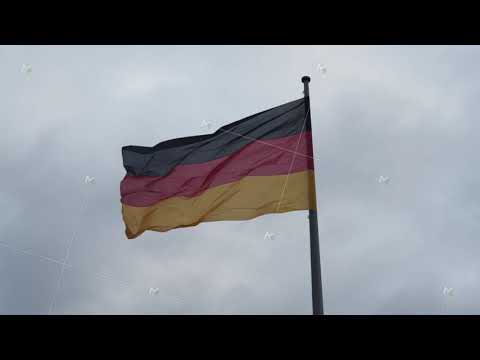 Close up of beautiful German Flag waving in the Wind with Overcast