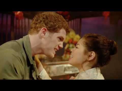 Miss Saigon 2014 official trailer still with helicopter imagery and crowd tableau