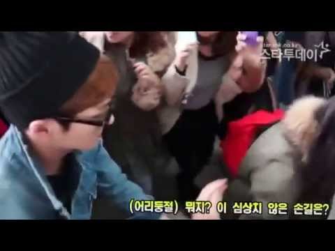 130308 Airport - Onew (SHINee) helps a woman