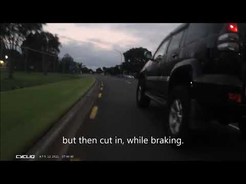 Car vs Cyclist near miss as he turns in front of me.