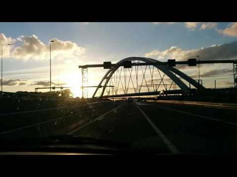 Driving into Amsterdam at sunset