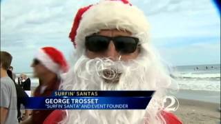 150 Santas surf on Christmas Eve