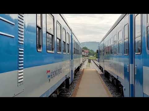 slow moving passenger trains crossing paths in Novi Marof, Croatia / Dva vlaka HŽ serije 7122