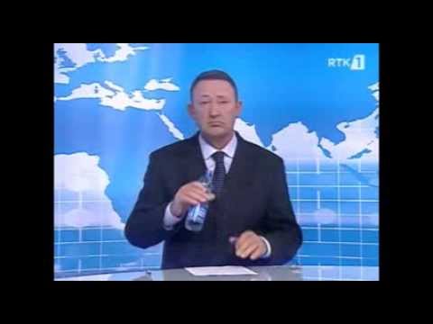 Albanian newsreader Mustafe Muqaj RTK drink a water during news edition