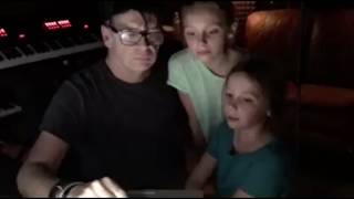 Gary Numan sings with daughters