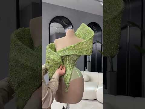 To order this green dress DM reineecouture A sculpted off-shoulder mermaid gown in a luminous