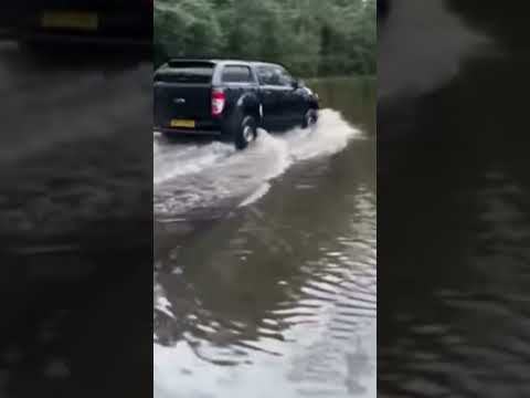 Heavy overnight rain caused roads to flood in England's northern city of Manchester on Wednesday