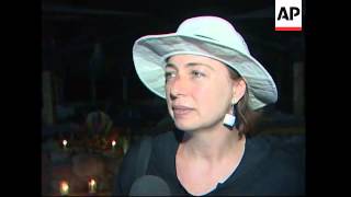 Exodus from Sinai resort after blasts, candlelit vigil