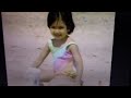 Sesame Street A Little Girl Putting Something Into Her Bucket At A Beach