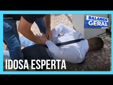 Elderly woman outsmarts scammer who tried to steal her bank card.