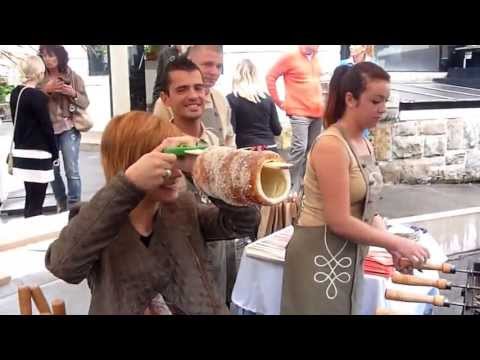 Ms. Timea (Timi) Antal baking her first chimney cake at the Budapest Zoo's Gundel Terrace