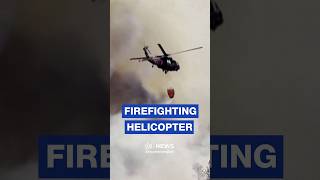Nevada Guard helicopter drops water on massive Hawk Fire