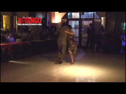  Fabian Peralta  and  Virginia Pandolfi  are  dancing  to  the  tango  "  Malvon  "