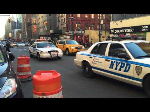 NYPD ANTI-TERROR HERCULES TEAM PATROLLING ON 8TH AVE. IN MIDTOWN AREA OF MANHATTAN IN NEW YORK CITY.