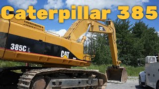 Caterpillar 385C L Excavator Digging Granite Blocks
