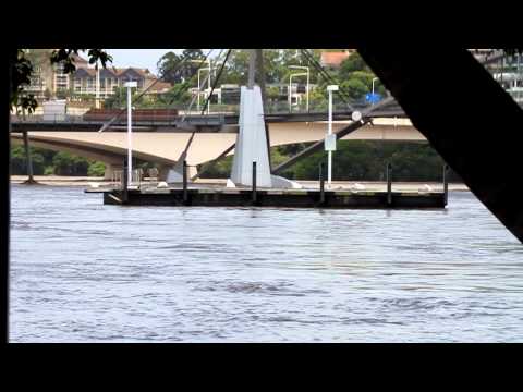 Big pontoon floating down river near Brisbane CBD
