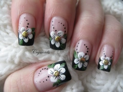 Nail art: Black french manicure with flower and studs