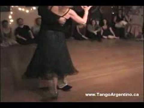  Mary Ann Casas  and  Oscar Casas  are  dancing  to  the  milonga  "  Milonga De Mis Amores  "