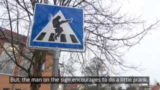 Traffic sign makes people do the Monty Python Silly Walk