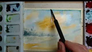 Watch a watercolor landscape transform before your eyes!